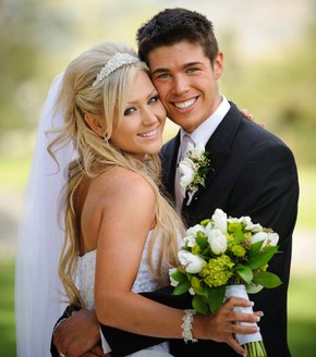 Photo of bride and groom smiling