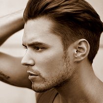 Photo of man with hair swept back