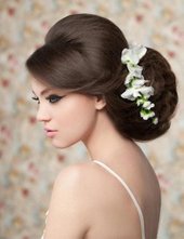 Phot of bride with hair up and small flowers