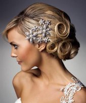 Photo of bride with small silver flowers in hair up